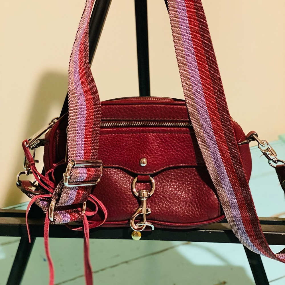 Leather burgundy Rebecca Minkoff bag in new condition. Cute guitar strap handle!